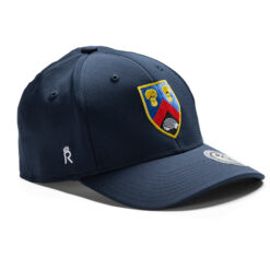 Rex Club | A navy blue Alderley Edge CC Stretch featuring a colorful embroidered crest on the front with various elements, including red and yellow shapes. The cap also has a small white logo on the side and a white circular patch on the brim. | Custom Caps | Custom Hats | Team Headwear | UK