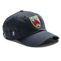 Rex Club | An Alderley Edge CC Stretch displaying a colorful embroidered crest on the front. The crest features three tennis rackets, an inverted V shape, and a black area with white identical shapes. The side of the cap is adorned with a small, white "R" and a crown above it. | Custom Caps | Custom Hats | Team Headwear | UK