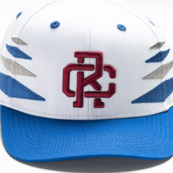 Rex Club | A Rex Club - Summer 24 - Slouch with blue accents on the brim and sides, featuring a red embroidered "CR" logo in the center front. Blue stitched ventilation holes are evenly spaced on top. | Custom Caps | Custom Hats | Team Headwear | UK