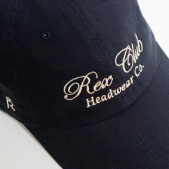 Rex Club | A navy blue baseball cap with the words 