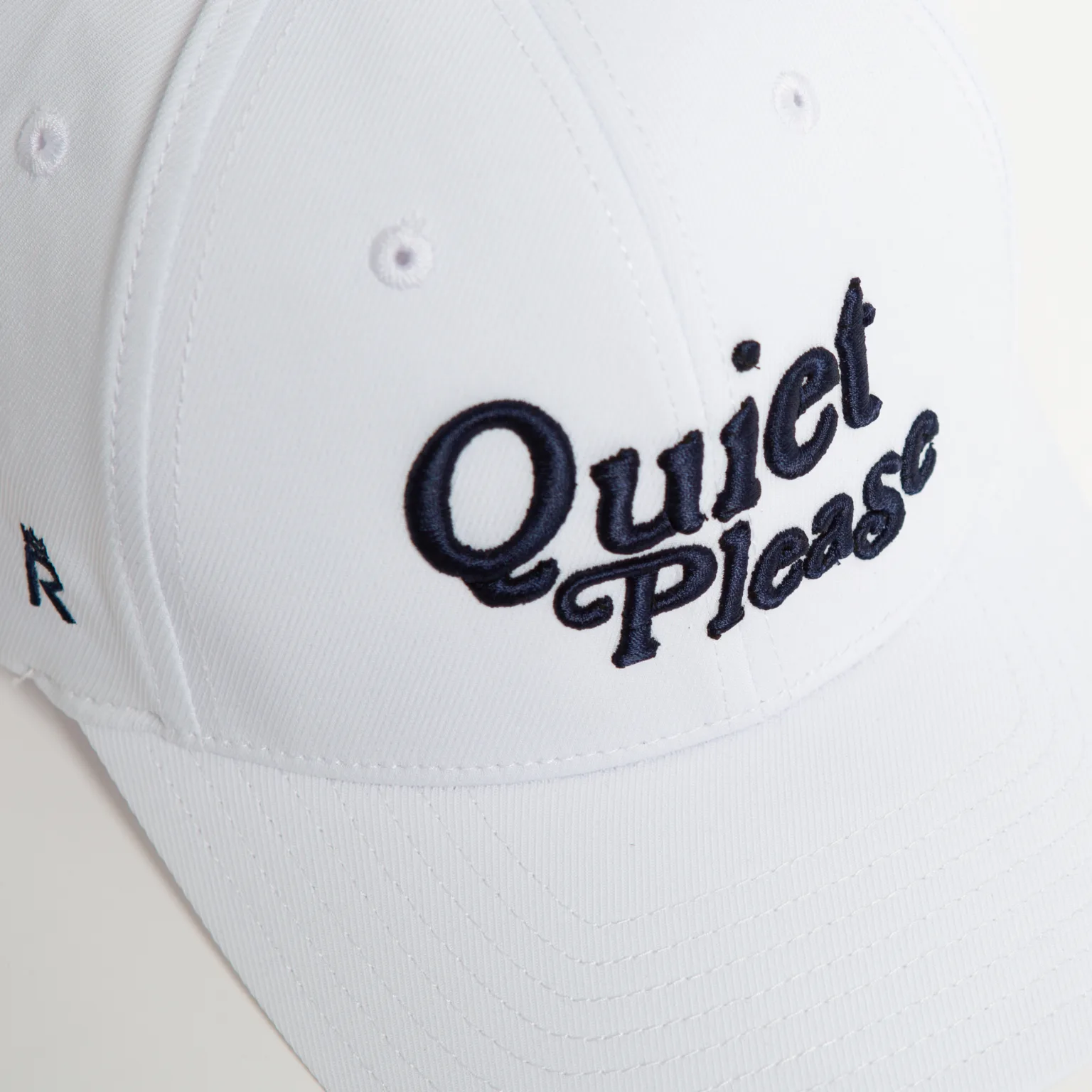 Rex Club | A close-up of the "Golf: Quiet Please" white baseball cap, featuring the phrase embroidered in black on the front. | Custom Caps | Custom Hats | Team Headwear | UK