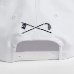 Rex Club | Close-up of the back of a Golf: Quiet Please white cap, showcasing an embroidered design of two crossed golf clubs and a checkered flag above the adjustable snapback strap. | Custom Caps | Custom Hats | Team Headwear | UK