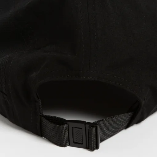 Rex Club | Close-up of the back of a Running Caps black cap, featuring an adjustable strap with a plastic clip buckle. The cap's fabric has visible stitching and a slightly textured look, shown resting on a flat surface. | Custom Caps | Custom Hats | Team Headwear | UK