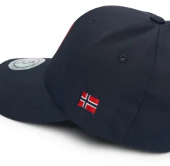 Rex Club | The North Berwick RFC Stretch is a navy blue baseball cap with a small embroidered Norwegian flag on the side and a circular sticker on the brim. | Custom Caps | Custom Hats | Team Headwear | UK