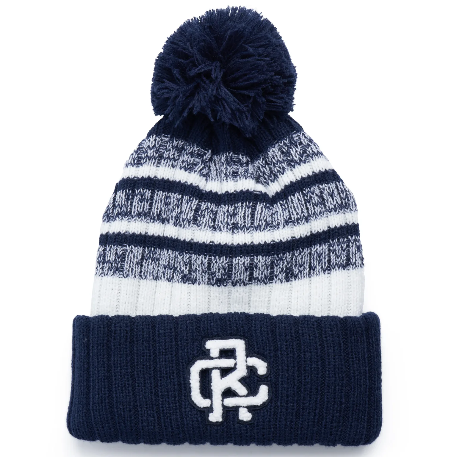 Rex Club | The Rex Club beanie features a navy cuff, white and blue patterned knit body, pom-pom top, and a chenille "RC" patch on the front. | Custom Caps | Custom Hats | Team Headwear | UK