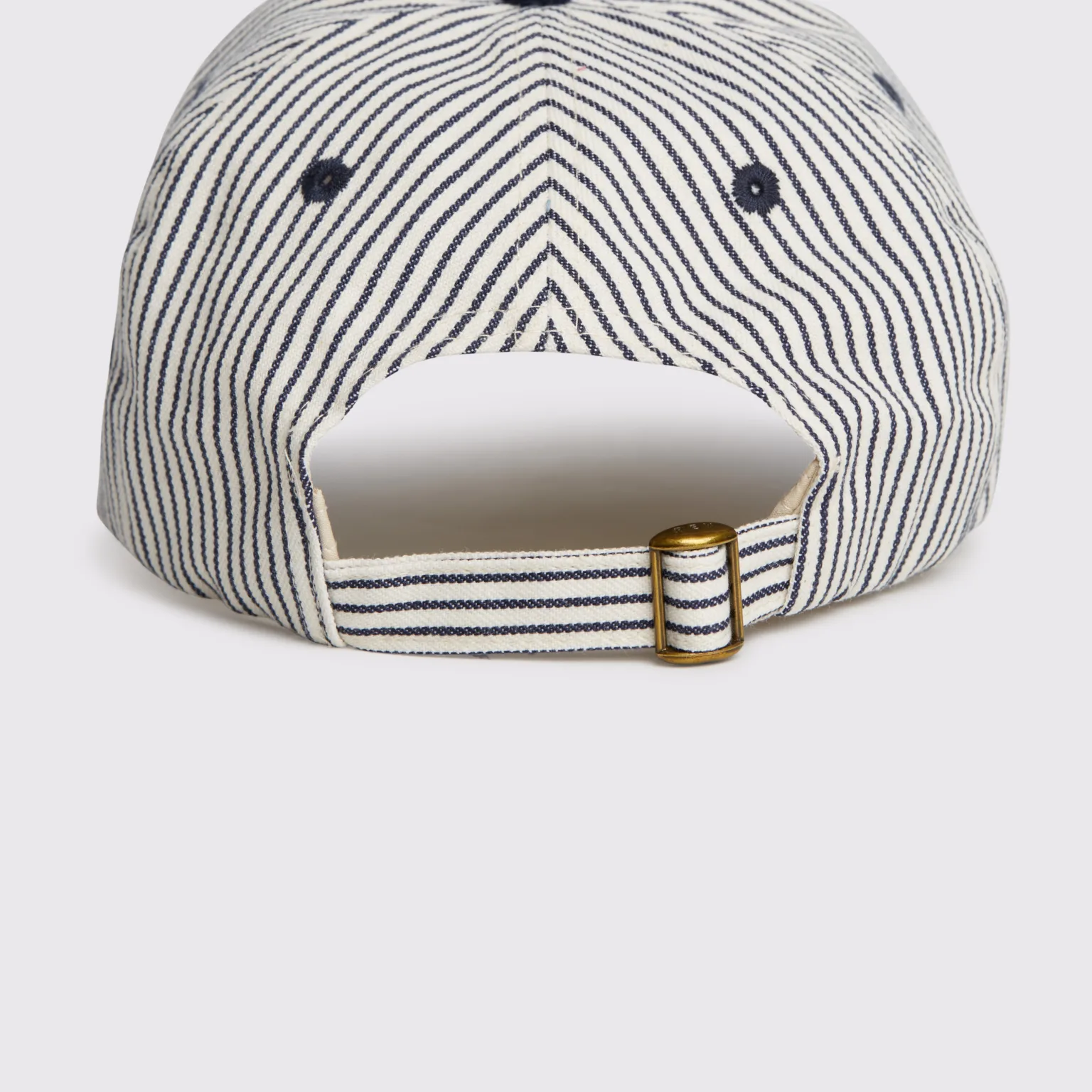 Rex Club | A close-up of the back of the RC - Two/Tone - SS26 Green (Copy) baseball cap featuring green and white vertical stripes, an adjustable strap, and a brass buckle. | Custom Caps | Custom Hats | Team Headwear | UK