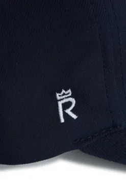 Rex Club | Close-up of OFFSEASON 26 dark navy fabric with a white embroidered 
