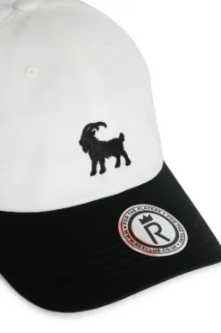 Rex Club | A white and black Goat baseball cap featuring a black embroidered goat on the front and a round brim sticker that says 