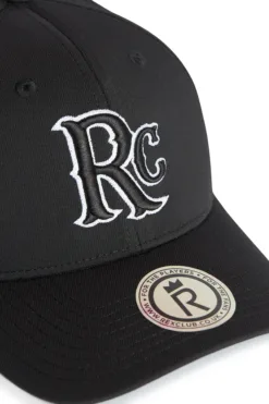 Rex Club | A close-up of the RC 26 Performance black baseball cap, featuring a white and black 