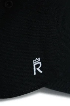 Rex Club | Close-up of a black Goat hat with a white embroidered 
